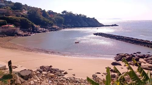 a view of a beach with rocks and the ocean at 津沙小筑 in Nangan