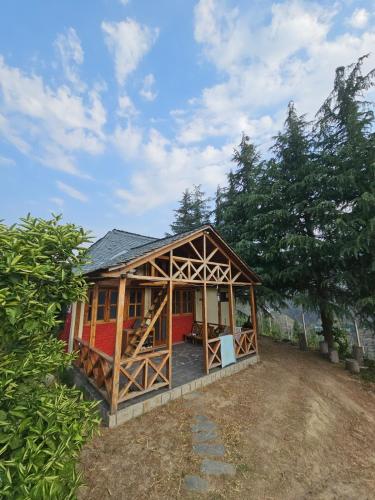a large house with a gambrel roof at The Nest Farm Stay in Karsog in Karsog