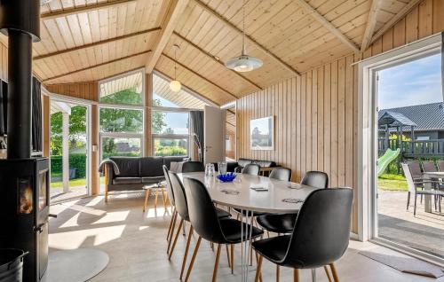 a dining room with a table and chairs at Pet Friendly Home In Hejls With Sauna - F04167 in Hejls