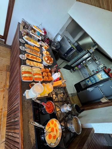 a buffet line with many different types of food at Pousada Amazing Jeri in Jericoacoara
