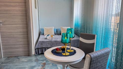 a room with a bed and a table in a room at B&B Antenna 2 by Ca-Sa Check in Chioggia