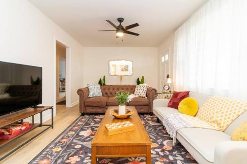 a living room with couches and a tv at Serene Walkable Fam Stay w/Toys! in Columbus