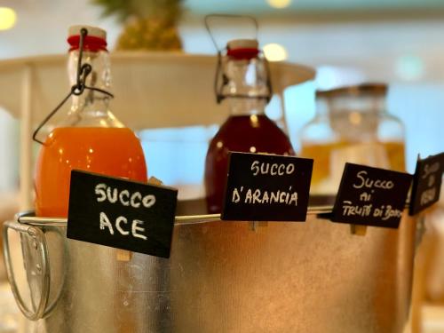 a couple of bottles of sauce in a kitchen at Hotel Gaby in Rimini