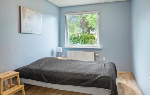 Una cama o camas en una habitación de Nice Home In Bandholm With Wifi - K10070