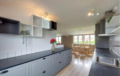 a kitchen with white cabinets and a counter top at 2 Bedroom Beautiful Home In Fleninge - S12280 in Fleninge
