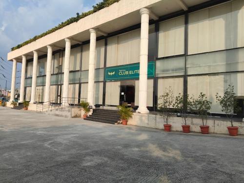 a building with a sign on the front of it at Spacious 3 BHK inHigher flr with Sunset, Lake View in Bengaluru
