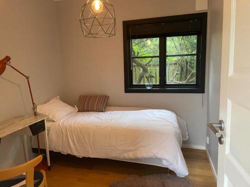 a bedroom with a bed and a window at 3-Bedroom Charming Lund Home in Lund