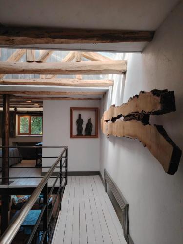 a room with a large piece of wood on the wall at Casas Viejas de Rauco, casa patrimonial en el campo in Curicó