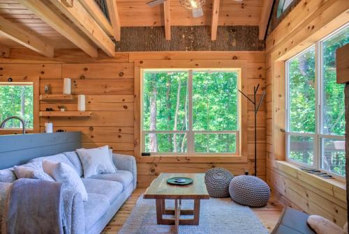 a living room with a couch and a table at Adventure of a Lifetime by Carolina Mornings in Saluda