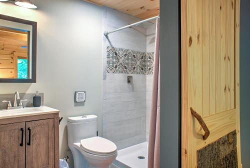 a bathroom with a toilet and a sink and a shower at Adventure of a Lifetime by Carolina Mornings in Saluda