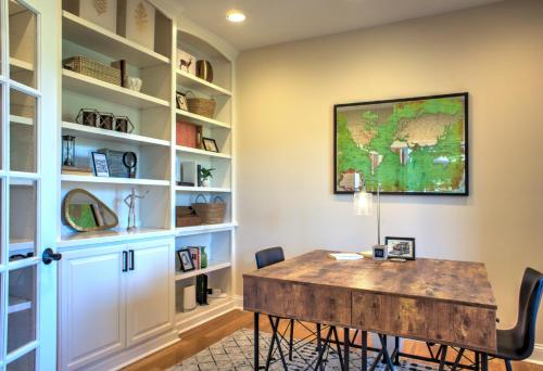 a home office with a table and bookshelves at Dos Brisas by Carolina Mornings in Mars Hill