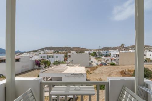 a view of the city from the balcony of a house at Ostria Hotel  in Adamas