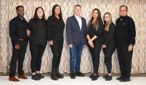 a group of people standing in front of a wall at Consort Hotel in Rotherham