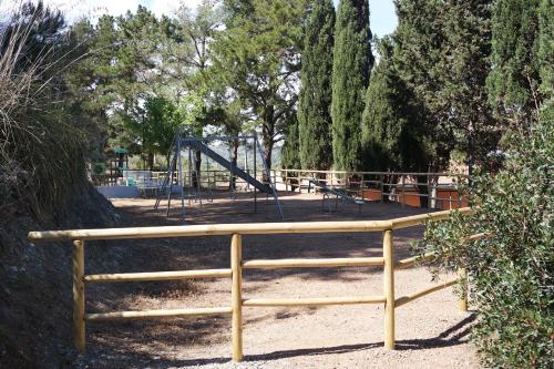 a park with a playground with a slide at Residence Reale in Porto Azzurro