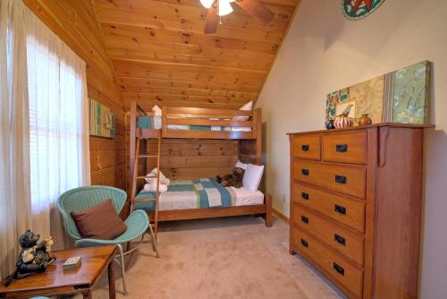 a bedroom with a bunk bed and a desk and chairs at Sky High by Carolina Mornings in Swiss