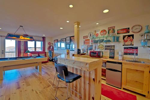 a kitchen with a pool table and a billiards at Sky High by Carolina Mornings in Swiss