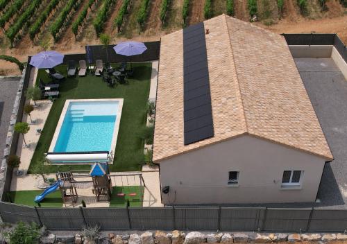 an aerial view of a house with a swimming pool at En Ardèche Villa de vacances l'Olympe climatisée avec sa piscine privée et chauffée in Joyeuse