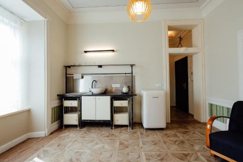 a kitchen with a sink and a counter at Opera apartments in Banská Štiavnica