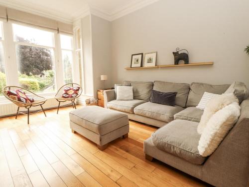a living room with a couch and a chair at 43 Station Road in Keswick