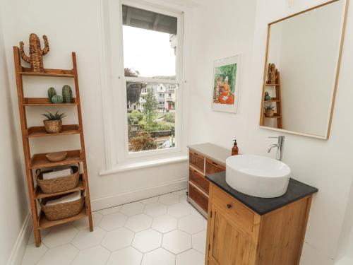 a bathroom with a sink and a window at 43 Station Road in Keswick