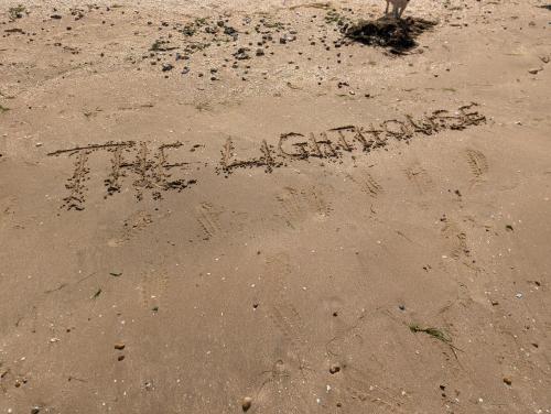 a word written in the sand on the beach at The lighthouse in Leysdown-on-Sea