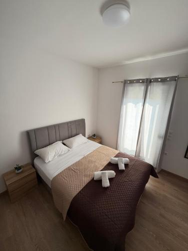 Ένα ή περισσότερα κρεβάτια σε δωμάτιο στο Serenity apartment sea view