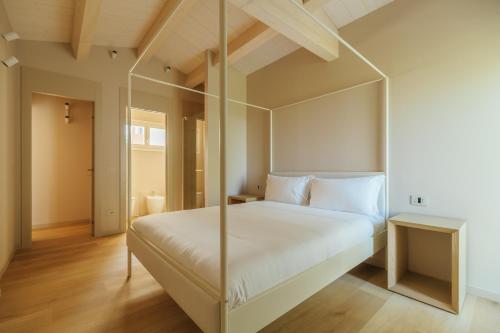 Ένα ή περισσότερα κρεβάτια σε δωμάτιο στο Portonovo Suites