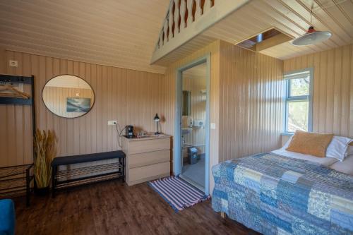 Voodi või voodid majutusasutuse Efri-Vík Bungalows toas