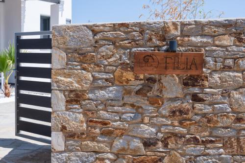 a brick wall with a sign on it next to a keyboard at Filia Skyros Suites in Skiros