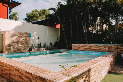 a swimming pool in the backyard of a house at Altos del Iguazu in Puerto Iguazú