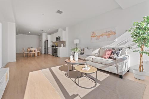 a living room with a couch and a table at Modern Retreat in Koreatown - Perfect for Your LA Stay! in Los Angeles