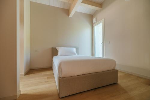 Ένα ή περισσότερα κρεβάτια σε δωμάτιο στο Portonovo Suites