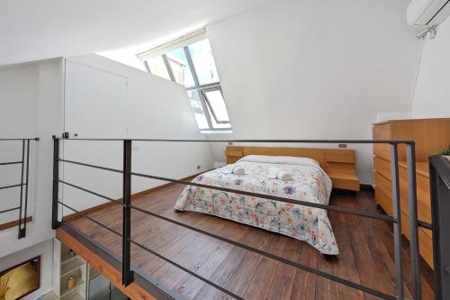 Letto o letti in una camera di Urbino Loft - City Center on foot