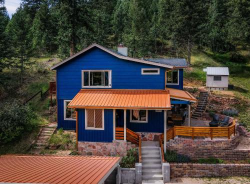 a blue house with an orange roof at Cobalt Peak - Pet-Friendly Sauna Panoramic Views in Cascade-Chipita Park