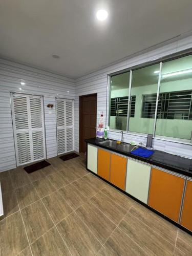 a bathroom with a sink and a counter top at Best Day Homestay ! in Kangar