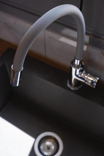 a close up of a kitchen sink with a faucet at Filia Skyros Suites in Skiros