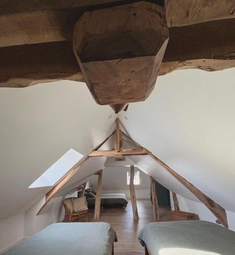 Postel nebo postele na pokoji v ubytování Gîte Le Clouvillou