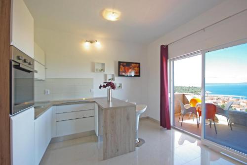 A kitchen or kitchenette at Apartments Herceg