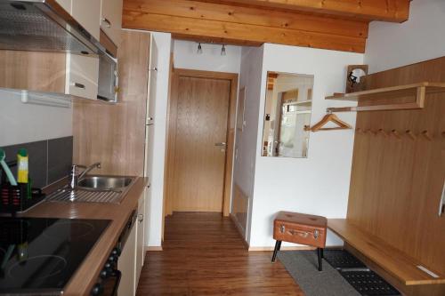 a kitchen with a sink and a counter top at Appartement Carola in Sankt Gallenkirch