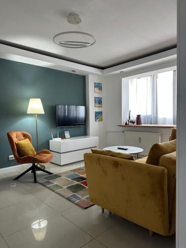 a living room with a couch and a table at 2 rooms condo in city center in Bucharest