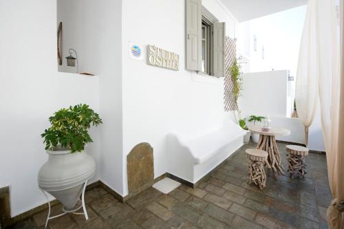 Ένα ή περισσότερα κρεβάτια σε δωμάτιο στο Ostria Studios 
