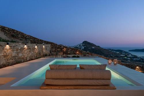 a swimming pool in a villa with a view at Youtopia Ios Villas in Ios Chora