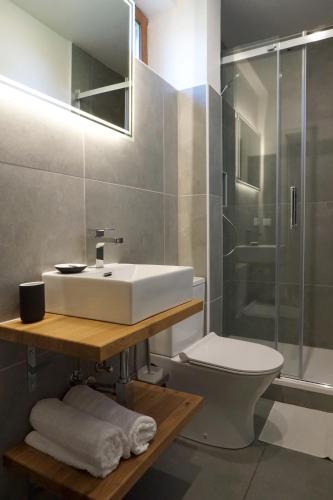 a bathroom with a sink and a toilet and a shower at Panorama Apart Fichtelberg in Fichtelberg