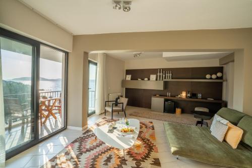 a living room with a couch and a table at Med-Inn Hotel in Gulluk