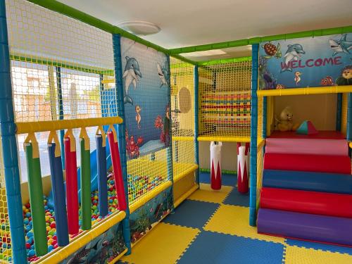 a play room with a bunch of baseball equipment at Hotel Plamena Palace in Primorsko