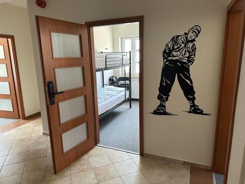 a man on a snowboard painted on a wall at Mololo Art Hostel in Sopot