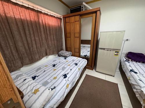 Giường trong phòng chung tại Porto marina residence