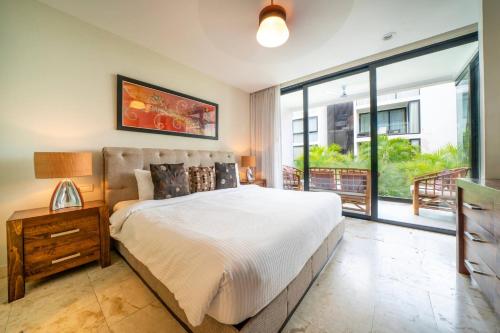 Postel nebo postele na pokoji v ubytování 2 Bedroom condo with Pool in the center of Playa del Carmen - Anah Playa