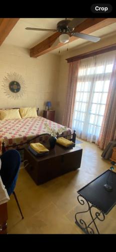 Кровать или кровати в номере Gozo Entire Villa with Large Pool Sea and Country Views