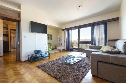 a living room with a couch and a rug at LV Premier Apartments Clerigos- RE1 in Porto
